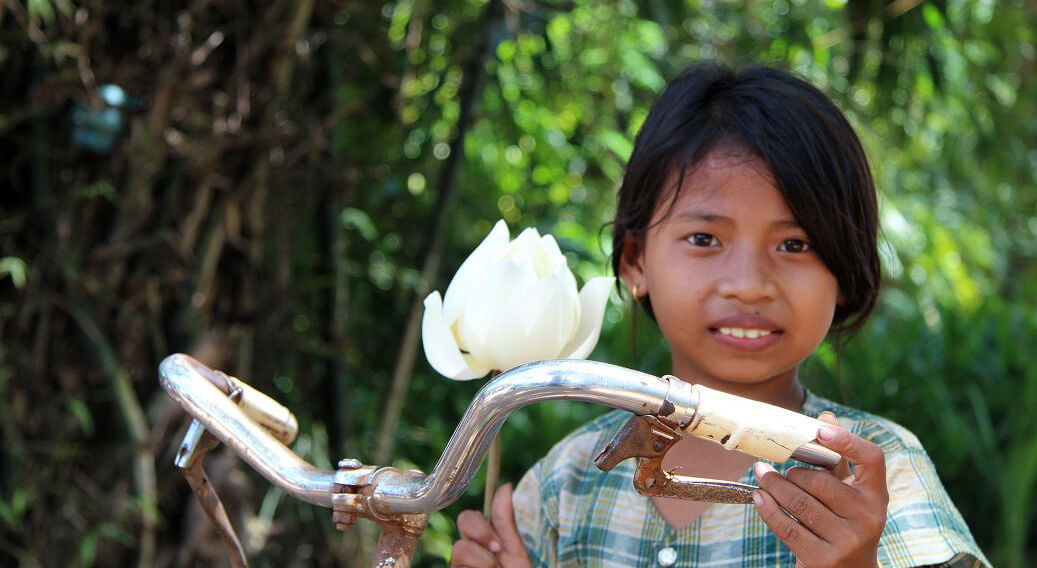 Girl with Lotus in Cambodia