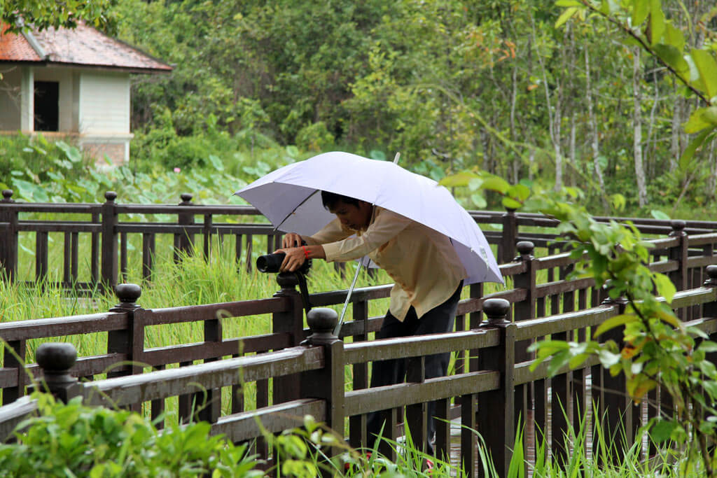 Ratanak Eath - Angkor Tourguide - takes a Lotus flower photo