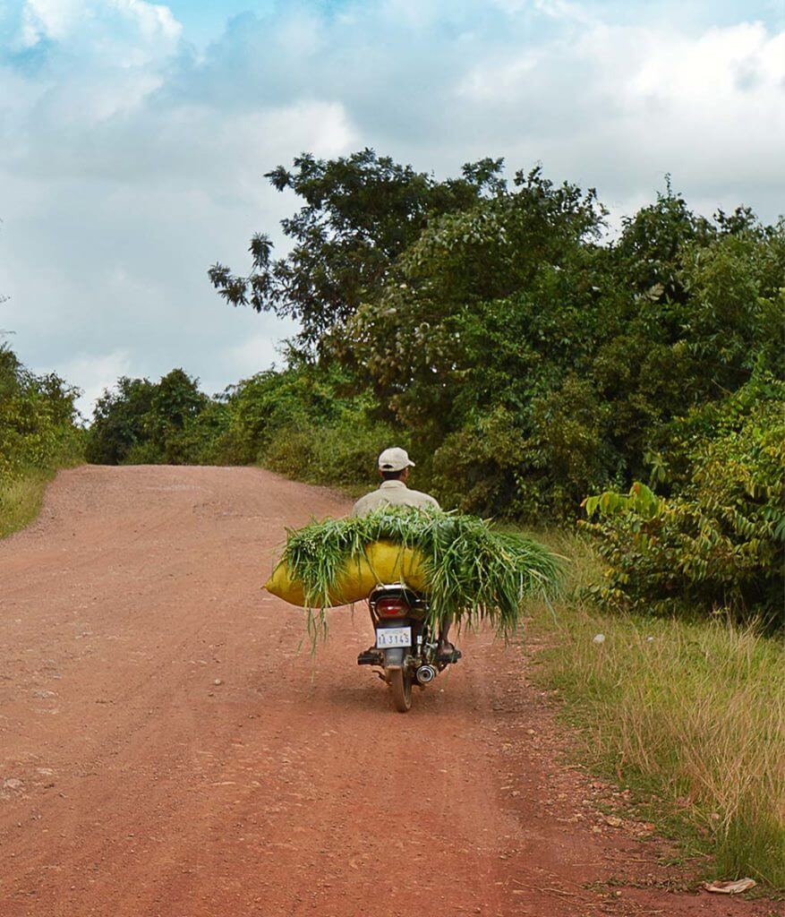 Motorradfahrer in Kampot, Kambodscha