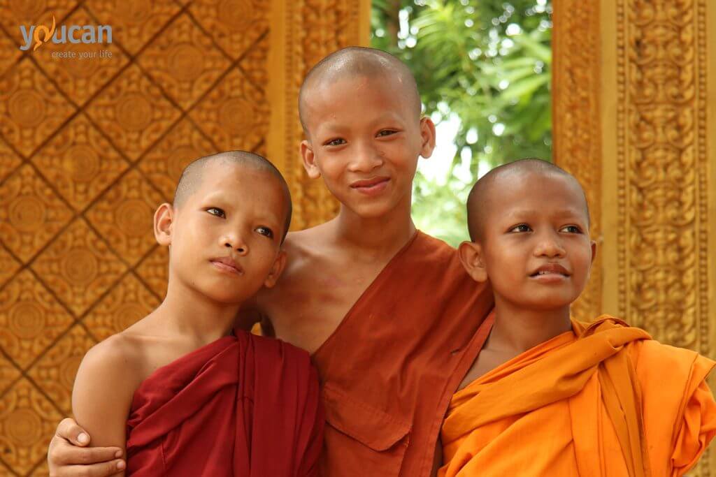 cambodia monks tonle sap smiling