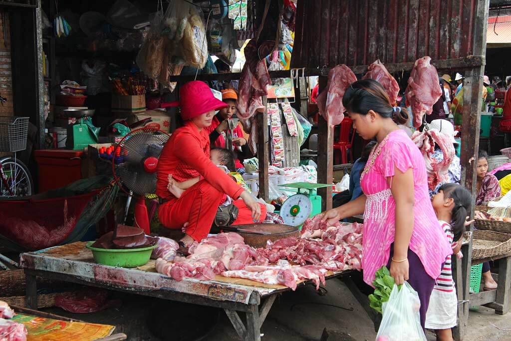 Butcher at Pshar Leu Market in Siem Reap