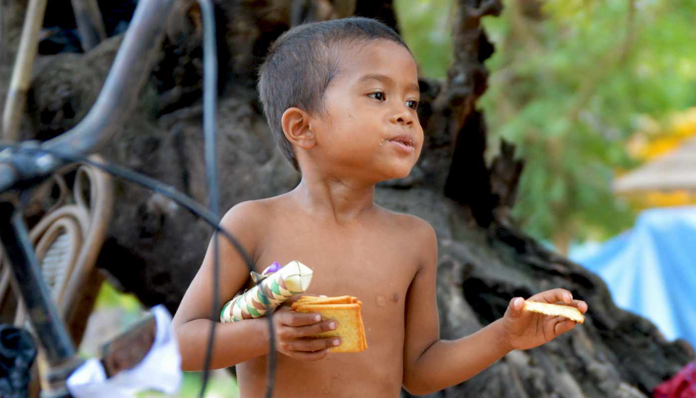 Boy with crackers - Ta Prohm Temple, Cambodai