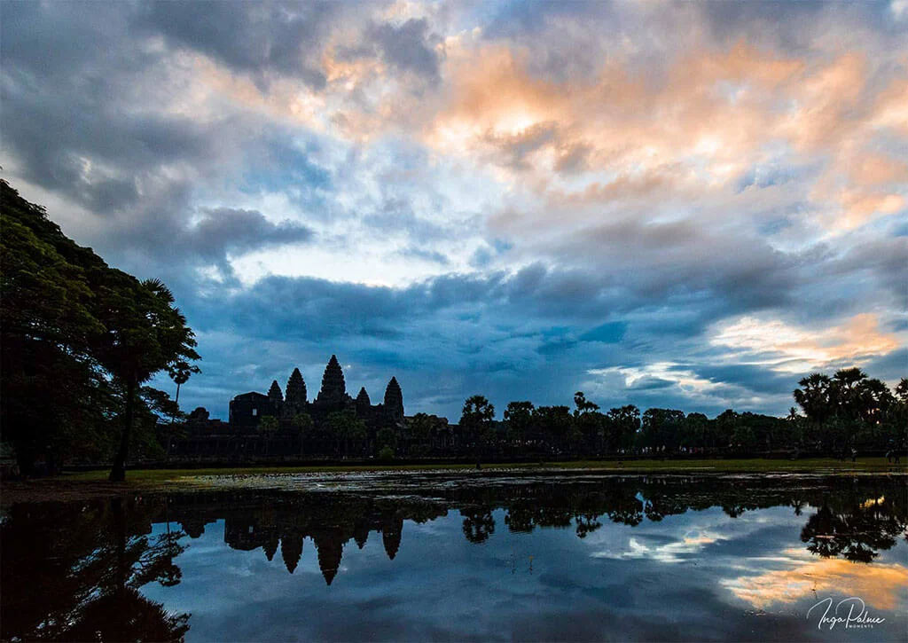 Angkor Wat sunrise with dramatic sky and clouds