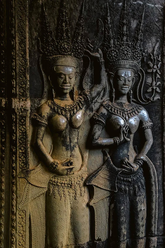 Carving: Two devata at a wall of Angkor Wat. 