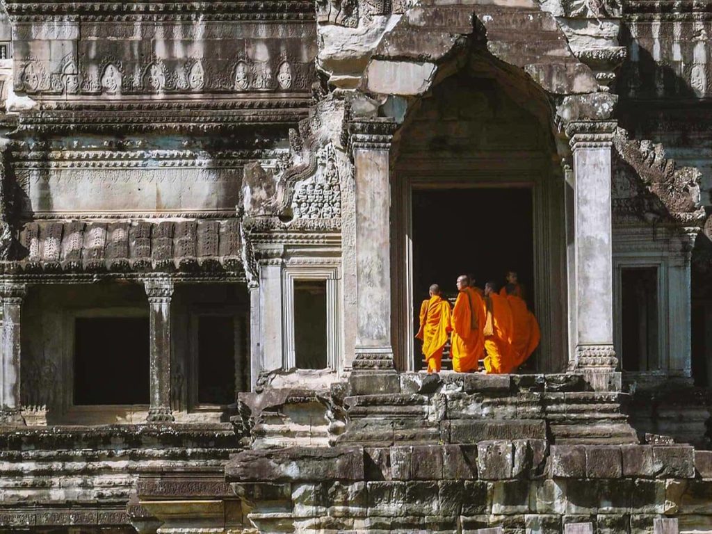 Monks at the east gate of Angkor Wat. 